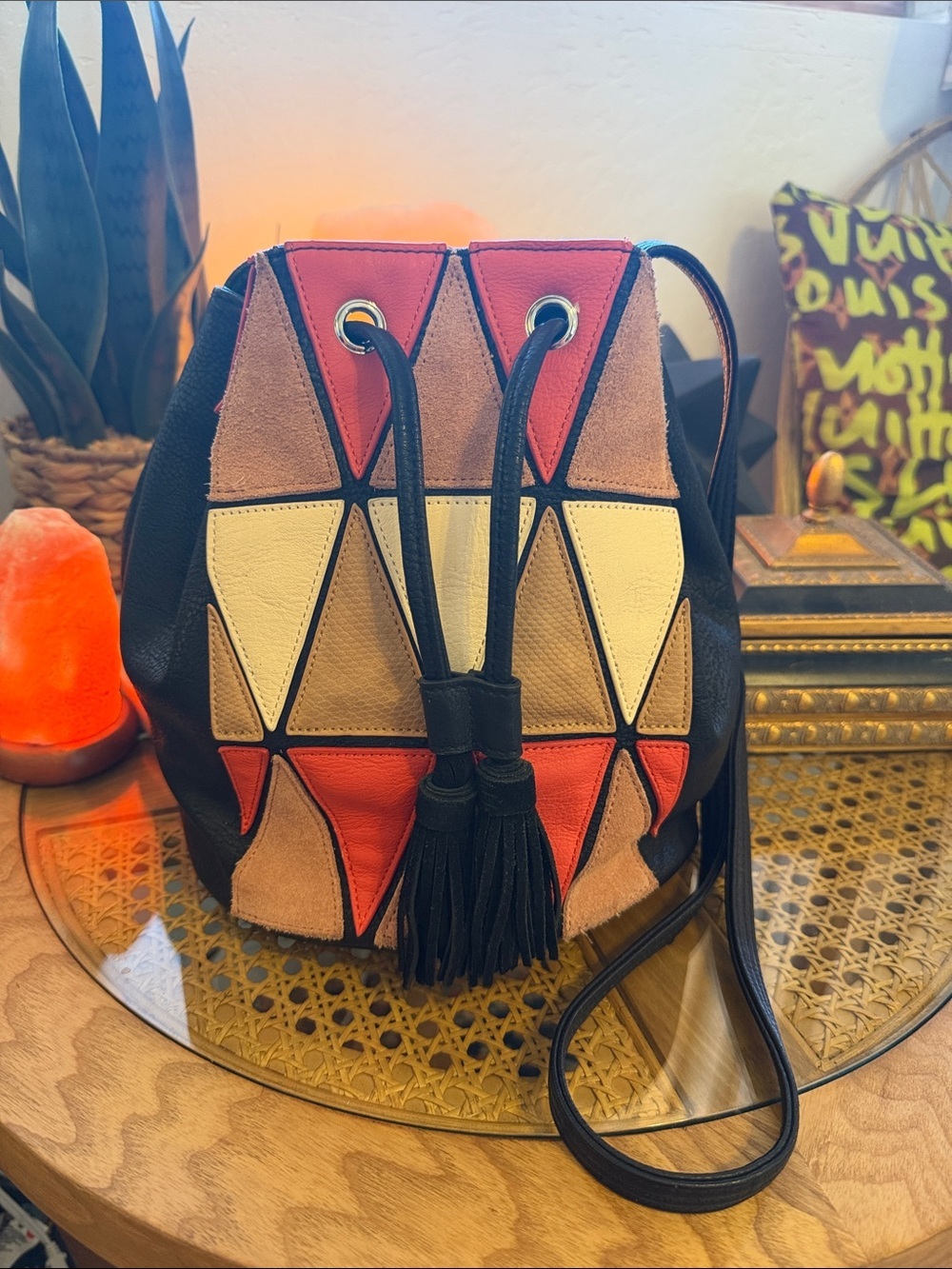 BCBGeneration Black Crossbody Drawstring Bag with Red, Tan, Cream Panels